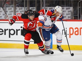 NEWARK, NJ - JANUARY 07: Taylor Hall #9 of the New Jersey Devils and Adam Larsson #6 of the Edmonton Oilers pursue the puck during the second period at the Prudential Center on January 7, 2017 in Newark, New Jersey.
