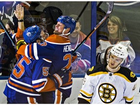 Edmonton Oilers Mark Letestu and Matt Hendricks celebrate a goal as Boston Bruins defenceman Colin Miller skates off the ice at Rexall Place in Edmonton on Dec. 2, 2015. (File)