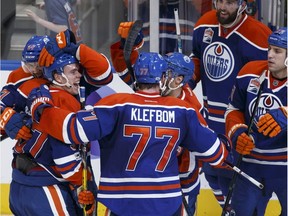 Edmonton Oilers star Connor McDavid celebrates his game winning overtime goal with teammates during NHL action against the Florida Panthers at Rogers Place in Edmonton on Jan. 18, 2017.