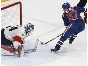 Edmonton's Connor McDavid (97) scores the game winning overtime goal on Florida's goaltender James Reimer (34) during the third period of a NHL game between the Edmonton Oilers and the Florida Panthers at Rogers Place in Edmonton, Alberta on Wednesday, January 18, 2017.