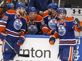 Edmonton's Connor McDavid (97) waits for a review with teammates after scoring the game winning overtime goal on Florida's goaltender James Reimer (34) during the third period of a NHL game between the Edmonton Oilers and the Florida Panthers at Rogers Place in Edmonton, Alberta on Wednesday, January 18, 2017. Ian Kucerak / Postmedia