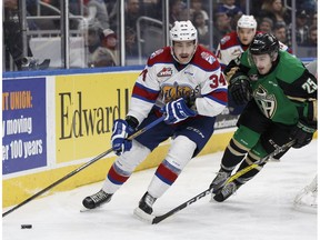 Edmonton's Graham Millar (left) battles Prince Albert's Sean Montgomery during the second period of a WHL game between the Edmonton Oil Kings and the Prince Albert Raiders at Rogers Place in Edmonton on Saturday, January 21, 2017.