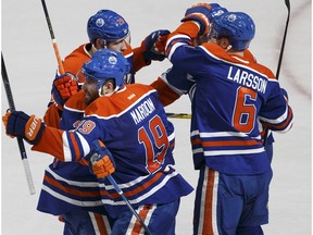Edmonton's Patrick Maroon (19) celebrates a goal with teammates during the third period of a NHL game between the Edmonton Oilers and the New Jersey Devils in Edmonton on Jan. 12, 2017.