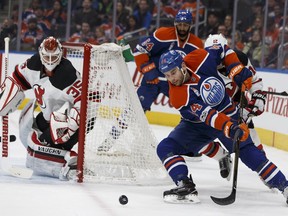 Edmonton's Zack Kassian (44) is stopped by New Jersey's goaltender Cory Schneider (35) during the second period of a NHL game between the Edmonton Oilers and the New Jersey Devils in Edmonton, Alberta on Thursday, January 12, 2017.