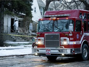 Crews continue to work at the scene of a fire at 10725 - 112 St., in Edmonton Thursday Jan. 19, 2017. Photo by David Bloom