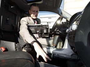 Edmonton Police Service Staff Sgt. Kevin Berge with Edmonton Drug and Gang Enforcemant (EDGE) demonstrates how a hidden compartment found by police works inside a Toyota Tundra truck at police headquarters in Edmonton on Wednesday, January 25, 2017.
