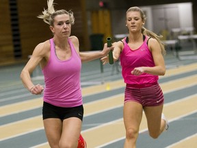Grace Werner passes the baton to Paige Ridout during practice for the 4 x 200 relay during the Bears and Pandas track and field practice on Wednesday. The Golden Bears open is the U of A Bears and Pandas track and field squad's first home event of the 2016/17 season. Golden Bears and Pandas also host the 2017 U SPORTS National Championship in March.