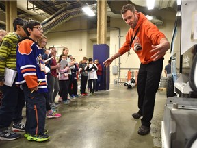 Jason Rimmer, assistant manager of engineering, describes one of the ice resurfacers to Grade 6 Holyrood students at the ICE School where students have the opportunity to hear from different staff members at Rogers Place in Edmonton, Friday, Jan. 13, 2017.
