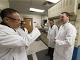 John Yao (left), CEO, TC Scientific Inc., gives Deron Bilous (right), minister of economic development and trade, a tour of TC Scientific after a trade support press conference in Edmonton on Wednesday, Jan. 11, 2017.