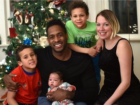 Julia and Jesse Lipscombe with baby Indiana, and stepsons Chile, (left) and Tripp.