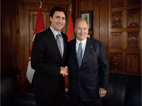 Prime Minister Justin Trudeau meets with the Aga Khan on Parliament Hill in Ottawa on Tuesday, May 17, 2016. Trudeau says he's looking forward to answering questions from the federal ethics commissioner about his Christmas vacation to a Caribbean island owned by the Aga Khan.