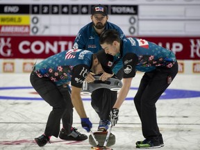 Team North America  skip Reid Carruthers of Winnipeg ,lead Colin Hodgson and second Derek Samagalski brush the stone during their 7-4 win over Team World's Niklas Edin of Sweden in the men's team competiion on Jan. 15, 2017, at the 2017 Continental Cup in Las Vegas