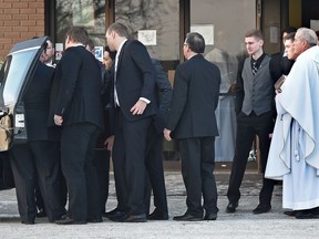 Pallbearers place the casket of Rachael Longridge into a hearse outside St. Theresa's Catholic Parish at her funeral on Wednesday, Jan. 4, 2017. Her mother, Christine Longridge, is charged with second-degree murder in the death.