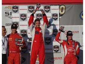 Stefan Rzadzinski on the Nissan Micra Cup podium following a first place win at the Canadian Tire Motorsport Park in Ontario on Sept. 4, 2016.