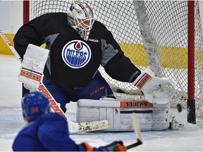 Oilers Jujhar Khaira (54) fires the puck on goalie Laurent Brossoit during practice at Rogers Place in Edmonton, Tuesday, January 17, 2017. Brossoit will start against the Calgary Flames on Saturday.