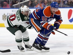 The Edmonton Oilers' Mark Letestu battles the Minnesota Wild's Jordan Schroeder at Rogers Place on Tuesday, Jan. 31, 2017. (David Bloom)