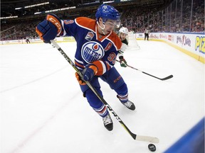 The Edmonton Oilers' Ryan Nugent-Hopkins (93) battles the Minnesota Wild's Marco Scandella (6) during first period NHL action at Rogers Place,  in Edmonton, Tuesday Jan. 31, 2017. Photo by David Bloom Photos for Robert Tychkowski, Terry Jones copy for Wednesday, Feb. 1, 2017, edition.