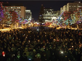 People gather in remembrance of the victims of Sunday's shooting at a Quebec City mosque in Edmonton Alta, on Monday January 30, 2017. Six people were killed and another 19 were injured when a gunman attacked the Centre Cultural Islamique de Quebec.