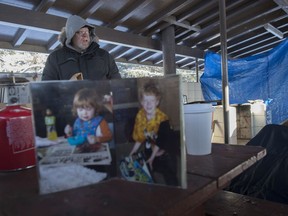 Peter Burgess has been raising money and awareness for the Stollery Children's Hospital by spending a full week in a cooking shelter at the Snow Valley Campground. His initial fundraising goal was $5,000, but as of Thursday, he'd raised over $18,000 and met many children and parents who have benefited from the services at the Stollery.  A photo of his children is on the table, Elan died 10 years ago and Ben is almost 17.