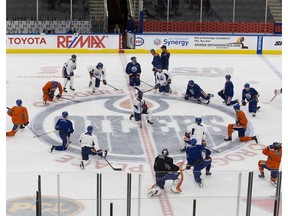 Players stretch during an Edmonton Oilers practice on Wednesday January 19, 2017 in Edmonton.
