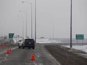 Police block the exit to Anthony Henday Drive on Manning Drive on Saturday Jan. 21, 2017 in Edmonton. Anthony Henday Drive was closed between Manning Freeway and 97 Street due to multiple vehicle collisions.