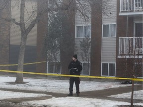 Police outside an apartment building at 11049 84 St. in Edmonton on Saturday, Jan. 21, 2017, the scene of the city's fifth homicide.