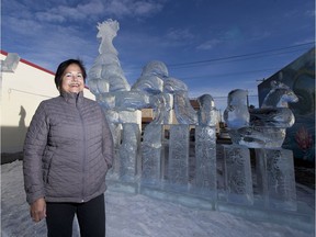 Ratan Lawrence of the Chinatown Business Association, inspects the ice sculpture garden parade, which runs along the route of the Lunar New Year Firecracker Parade. The parade begins at 11:30 AM, Saturday January 28, and runs along 97 Street, between 105 Avenue and 107 Avenue.