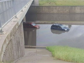 Vehicles stranded by a flood on the Whitemud on Wednesday, July 27, 2016.  The city estimates it will cost $2.4 billion to address Edmonton's flood mitigation issues.