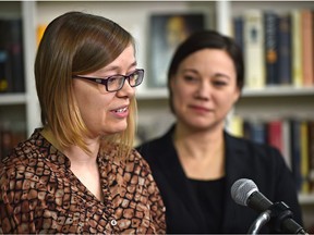 Danica LeBlanc, co-owner of Variant Edition Comics & Culture, is flanked by Environment Minister Shannon Phillips on Wednesday, Jan. 4, 2017.