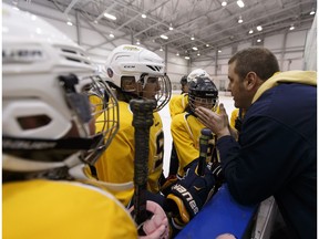 St Albert Adrenaline head coach Chris Kibermanis pumps up his team during a final game versus the Spruce Grove Coyotes in the Peewee McKinley Division of the 2017 Quikcard Edmonton Minor Hockey Week at Terwillegar Community Recreation Centre on Sunday, Jan. 22, 2017. (Ian Kucerak)