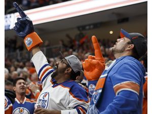 Edmonton fans celebrate Zack Kassian's (44) goal during the first period of a NHL game between the Edmonton Oilers and the Calgary Flames at Rogers Place in Edmonton, Alberta on Wednesday, October 12, 2016. Ian Kucerak / Postmedia Photos off Oilers game for multiple writers copy in Oct. 13 editions.