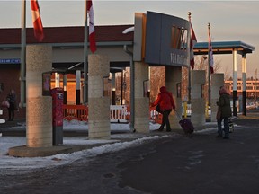 Passengers enter the Greyhound station in the VIA Rail building at 12360 121 St. in Edmonton on Wednesday, Jan. 25, 2017. One city councillor is calling for development of a transportation hub, in part to help Greyhound passengers make a connection to transit services.