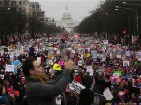 Protesters walk during the Women's March on Washington, with the U.S. Capitol in the background, on January 21, 2017 in Washington, DC. Large crowds are attending the anti-Trump rally a day after U.S. President Donald Trump was sworn in as the 45th U.S. president.