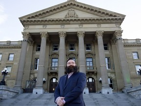 New Municipal Affairs Minister Shaye Anderson poses for a photo at the Alberta legislature, in Edmonton.