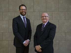 Advanced Education Minister Marlin Schmidt and Lorne Babiuk, University of Alberta vice-president of research, pose for a photo at the University of Alberta, in Edmonton Thursday Feb. 9, 2017.