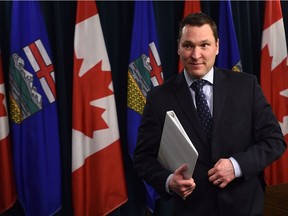 Economic Development and Trade Minister Deron Bilous leaves the podium after speaking at the Alberta legislature in Edmonton on Jan. 23, 2017.