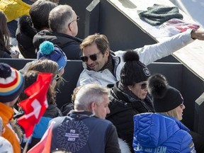 Lindsey Vonn of the United States, right, Roger Federer, Swiss tennis player, left, and his wife Mirka, center, look on during the men downhill race at the 2017 FIS Alpine Skiing World Championships in St. Moritz, Switzerland, Sunday, February 12, 2017. (/Alexandra Wey/Keystone via AP)