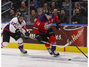 Nolan Patrick #19 of Team Cherry and Markus Phillips #52 Team Orr battle for the puck during the first period of their Sherwin-Williams CHL/NHL Top Prospects Game at the Videotron Center on January 30, 2017 in Quebec City.