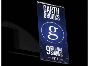 A Garth Brooks banner is revealed in the rafters during a special presentation for the 5 millionth Garth Brooks ticket sold on stage at Rogers Place in Edmonton on Friday, February 24, 2017.