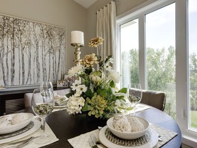 A traditional dining room table setting produces an elegant setting.