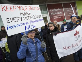 About fifty people rallied in front of Ottawa Centre MP Catherine McKenna's community office to remind the government of their campaign promise of electoral reform. Tuesday December 13, 2016. Errol McGihon/Postmedia
