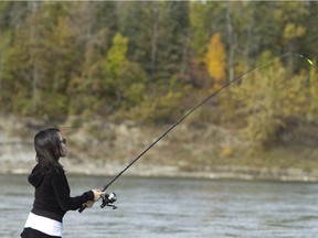 Ahreum Lee fishes in the North Saskatchewan River at Whitemud Park in 2012. The location is a popular fishing hole because of the adjacent natural creek.