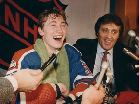 Wayne Gretzky shares the limelight with Phil Esposito on Feb. 24, 1982, in Buffalo after breaking Esposito's single-season goal-scoring record in a game against the Sabres.