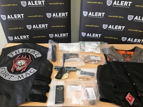 Two men were charged after police in Fort McMurray said they arrested two members of Hells Angels support clubs -- the Tribal and Syndicate motorcycle groups.