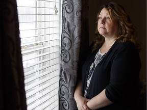 Brenda Hill survived a gunshot to the back while sleeping in her home in west Edmonton in December 2015. On Thursday, Feb. 9, 2017, she stands near where a bullet penetrated the wall and struck her in her bed.