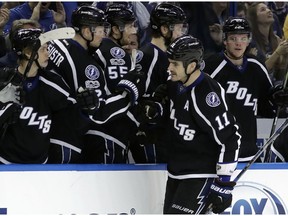 Tampa Bay Lightning center Brian Boyle (11) celebrates with the bench after scoring against the Anaheim Ducks during the shootout in an NHL hockey game Saturday, Feb. 4, 2017, in Tampa, Fla. The Lightning won 3-2.