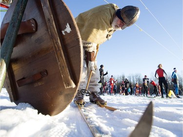 Dressed as a Viking Verner Steinbru puts on his skies during the start of the Canadian Birkebeiner at the Ukrainian Cultural Heritage Village on Saturday, Feb. 11, 2017.