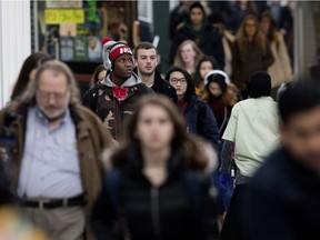 University of Alberta students and staff walk through Edmonton's HUB mall Feb. 8, 2017. New census data shows more Canadians are More Canadians are living alone, with parents or without children.