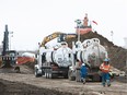 Cleanup continues at the site of a pipeline spill near 92 Avenue and Anthony Henday Drive in Edmonton, Alta., on Saturday, Feb. 18, 2017. (Codie McLachlan/Postmedia)