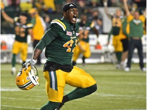 Edmonton Eskimos Odell Willis (41) celebrates defeating the  Saskatchewan Roughriders in overtime as they stopped them on a third down try during CFL action at Commonwealth Stadium in Edmonton, Saturday, July 8, 2016.